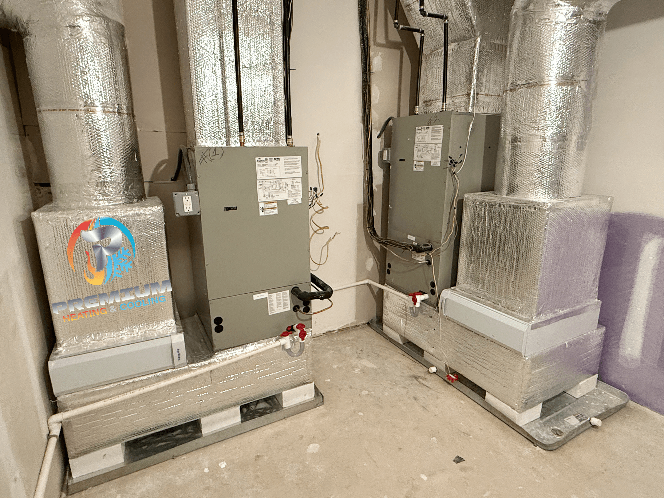 Two air handler units installed in basement mechanical room