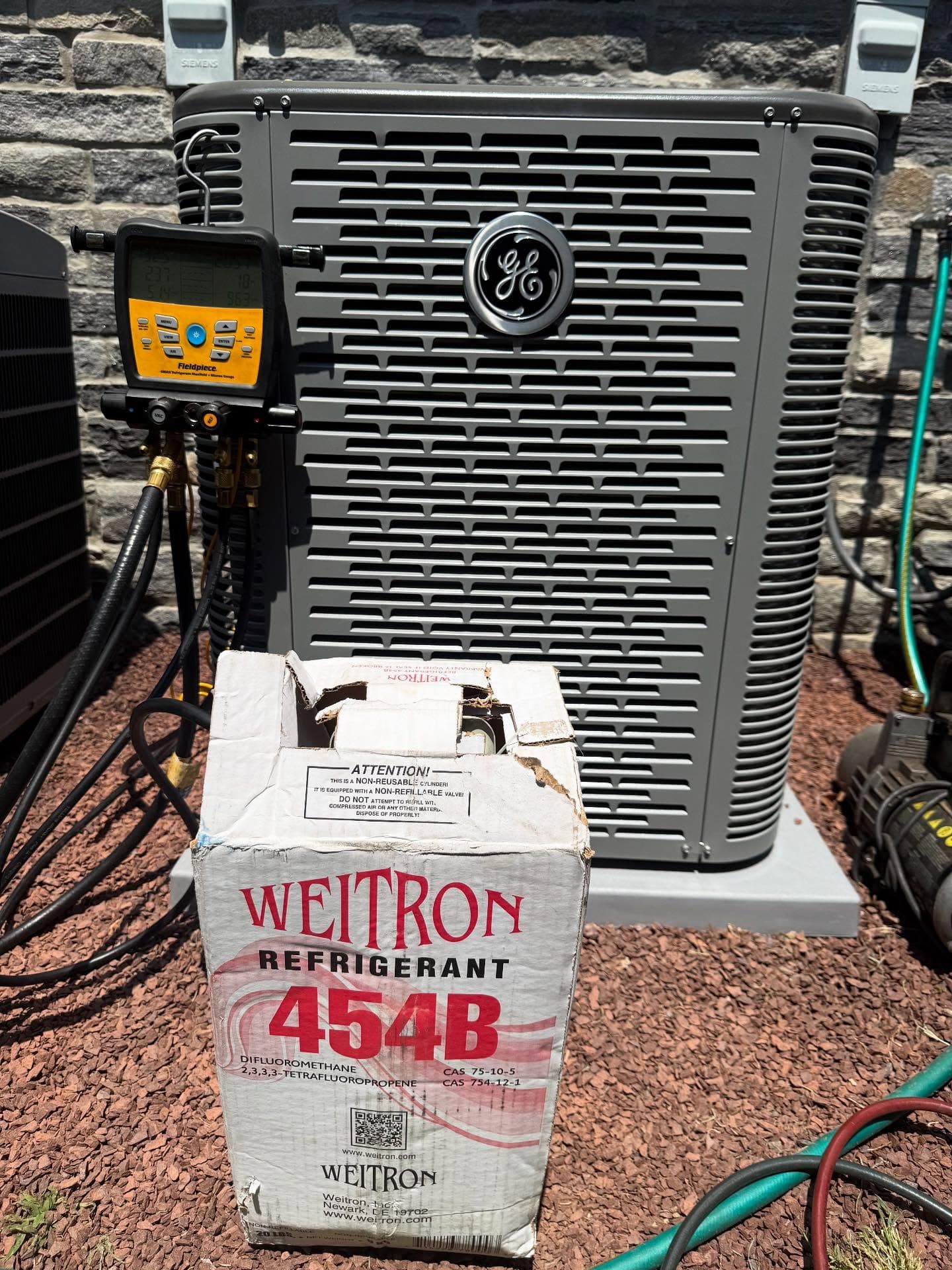 GE condenser with Fieldpiece gauges during installation